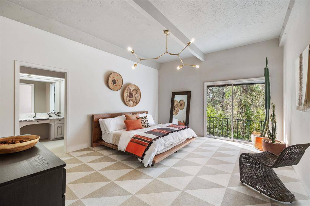Primary Bedroom with your a private balcony