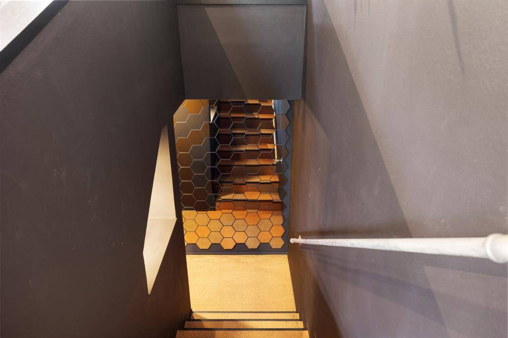 Steps going down to the 4th bedroom/game room