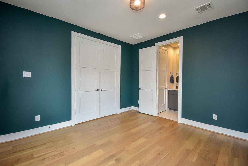 This bedroom is complete with its own private bathroom.
