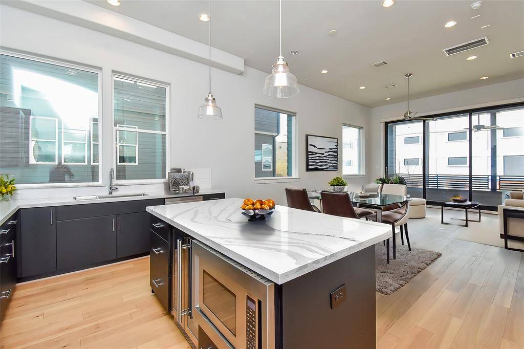 Virtually Staged: Fantastic open layout between the kitchen, dining and living areas.