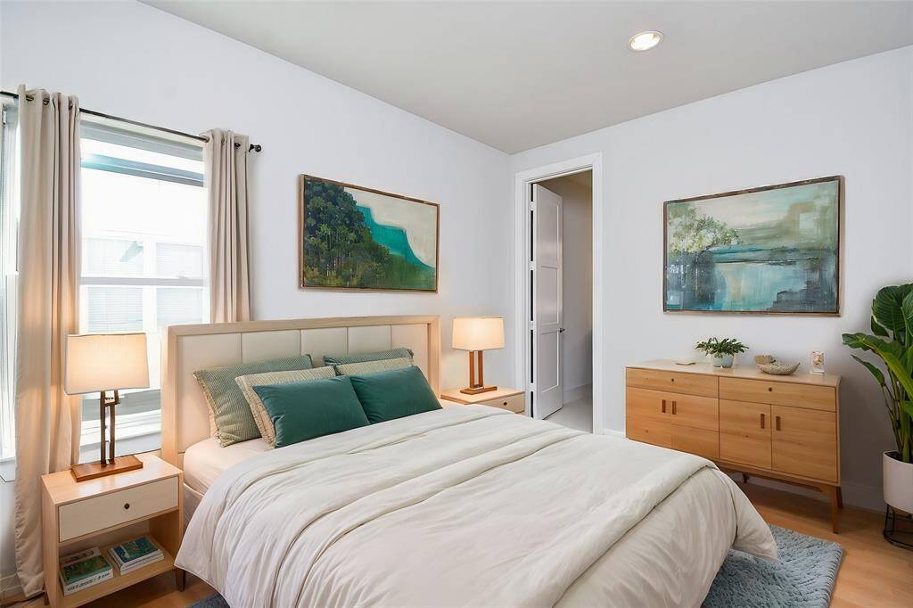 Virtually Staged: Secondary Bedroom featuring hardwood floors, and recessed lighting. This room is located on the third floor.