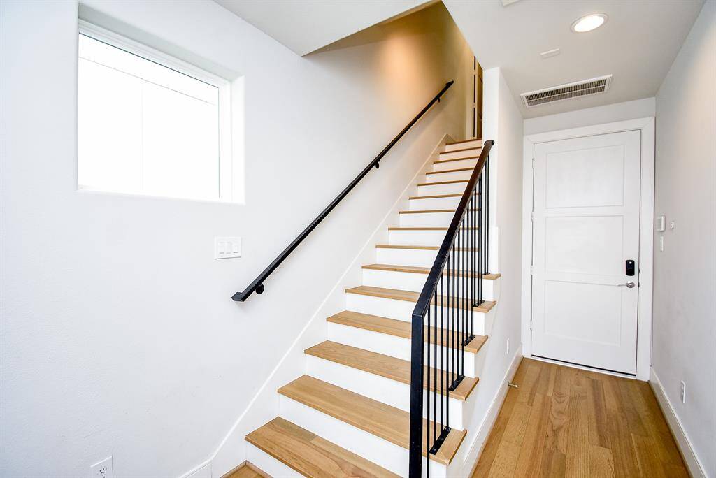 You'll be instantly greeted by beautiful hardwood floors, and a charming stair case.