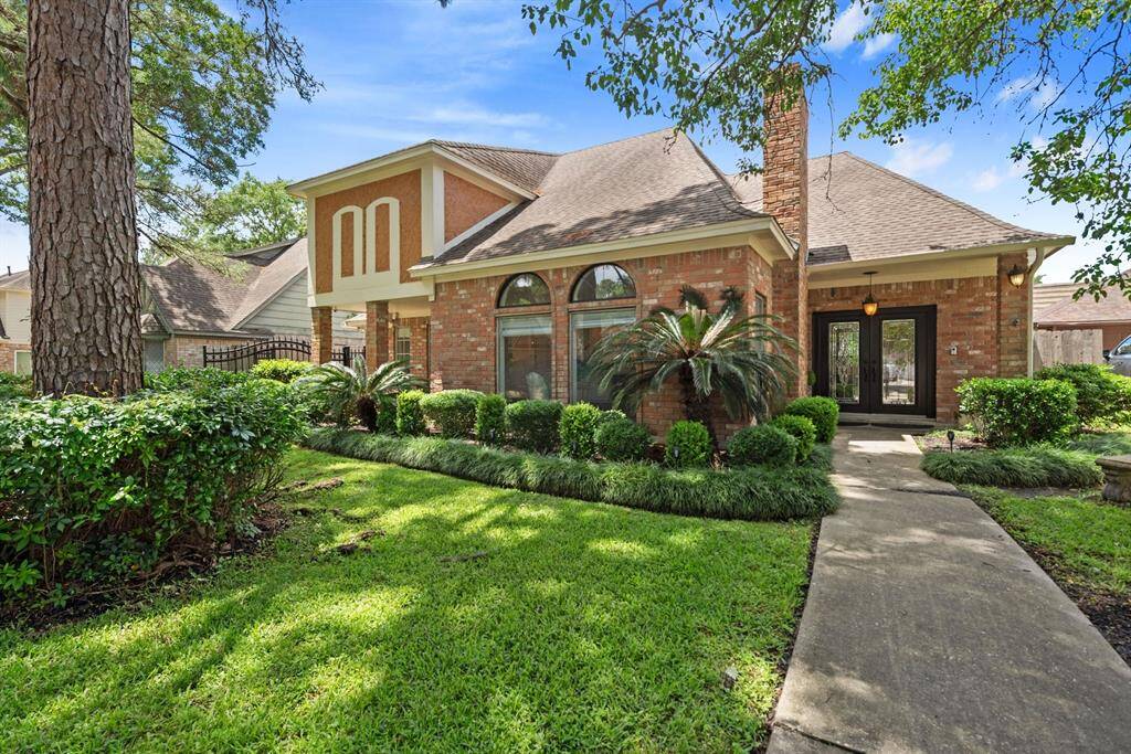 Beautiful outside and in, this 4 BR home on a quiet Champion Forest St. has two living areas plus a pool and spa. Make it yours before the hot summer days arrive!
