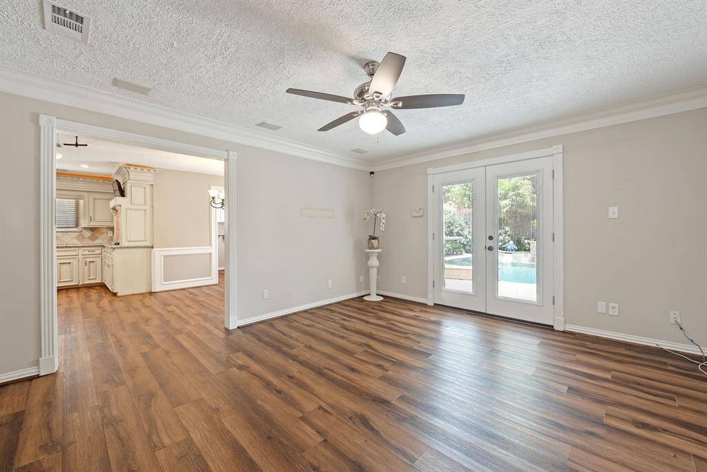 Second living area down has more French doors to the back and opens back to the front space making for a great entertaining flow.