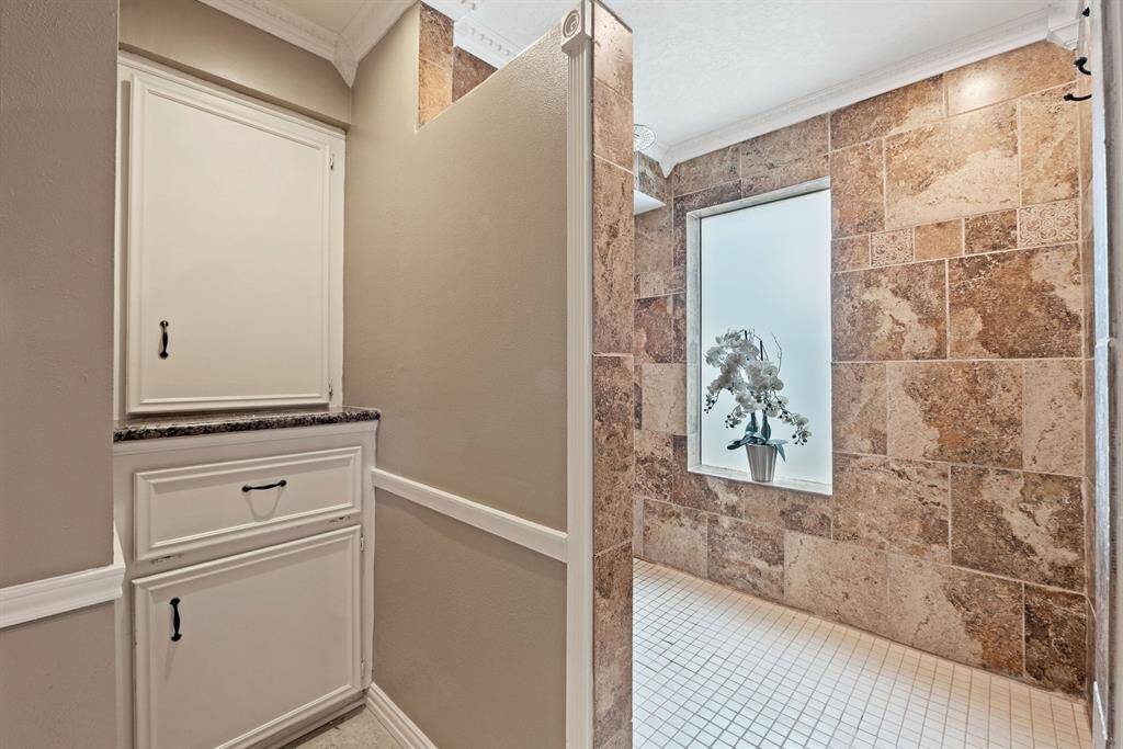 Primary bathroom is updated with large walk in shower.