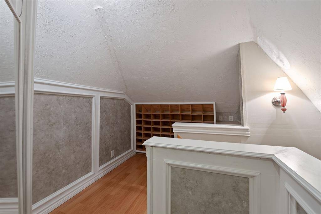 Great shoe storage and wood floors in the primary closet.