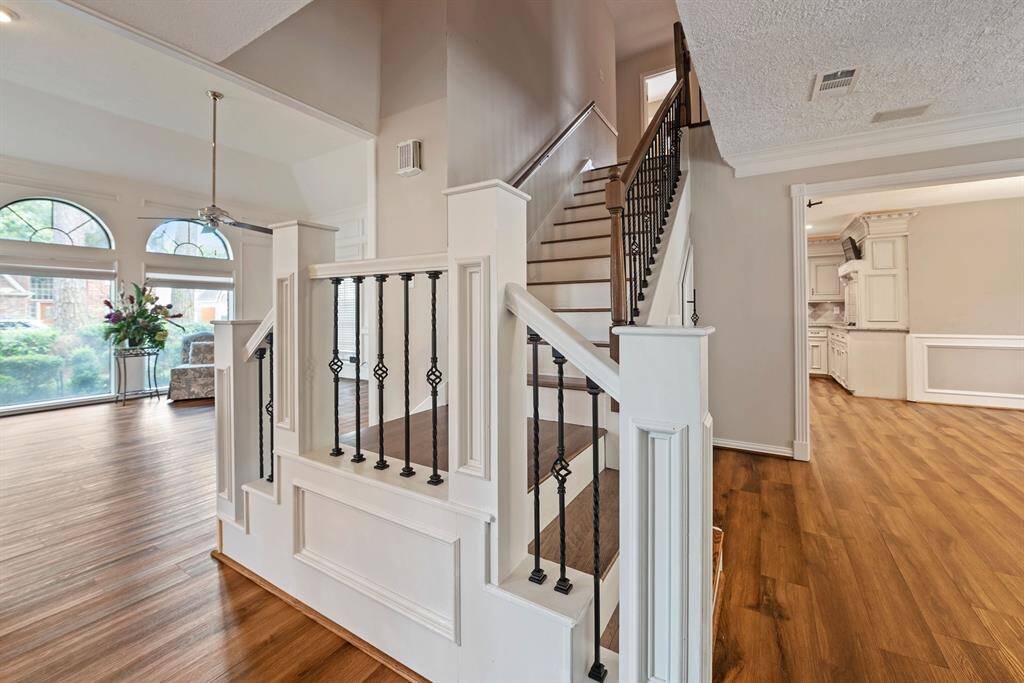 Head up the beautiful wrought iron staircase to check out the bedrooms from either of the living spaces