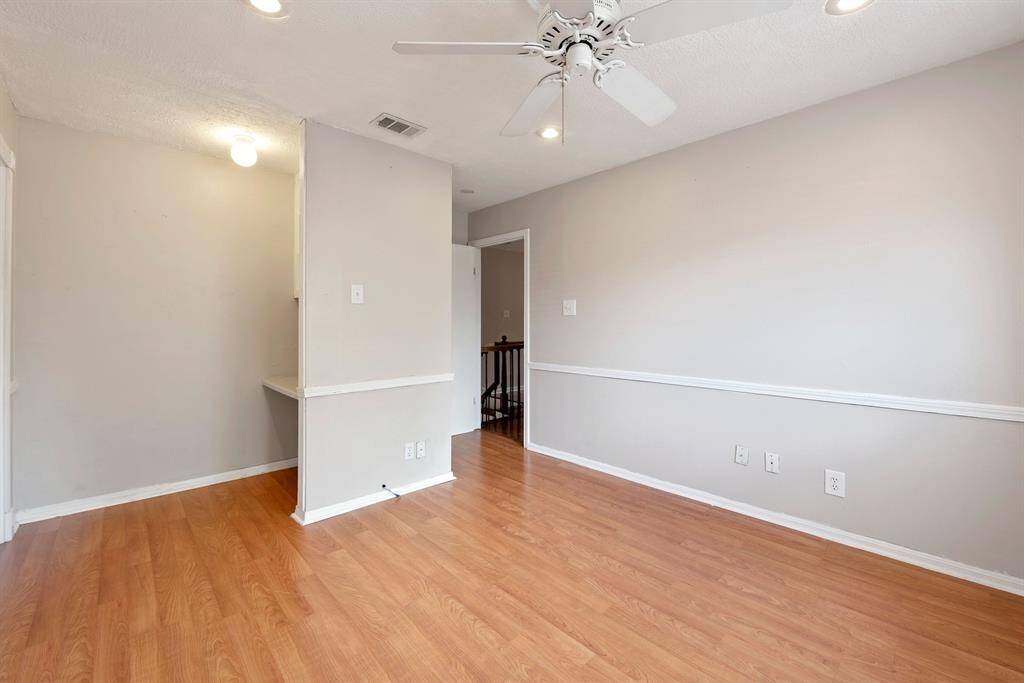 The largest of the three upstairs rooms is at the back and overlooks the yard.