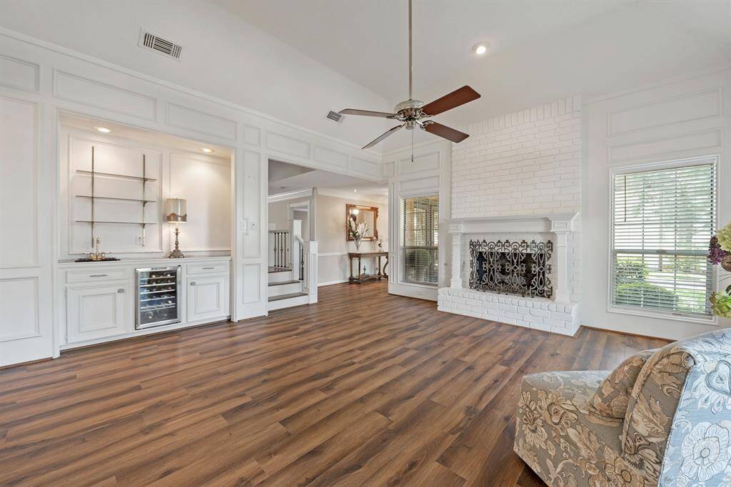 The front living area boasts a fireplace and a bar area. What a perfect area in which to hold parties.