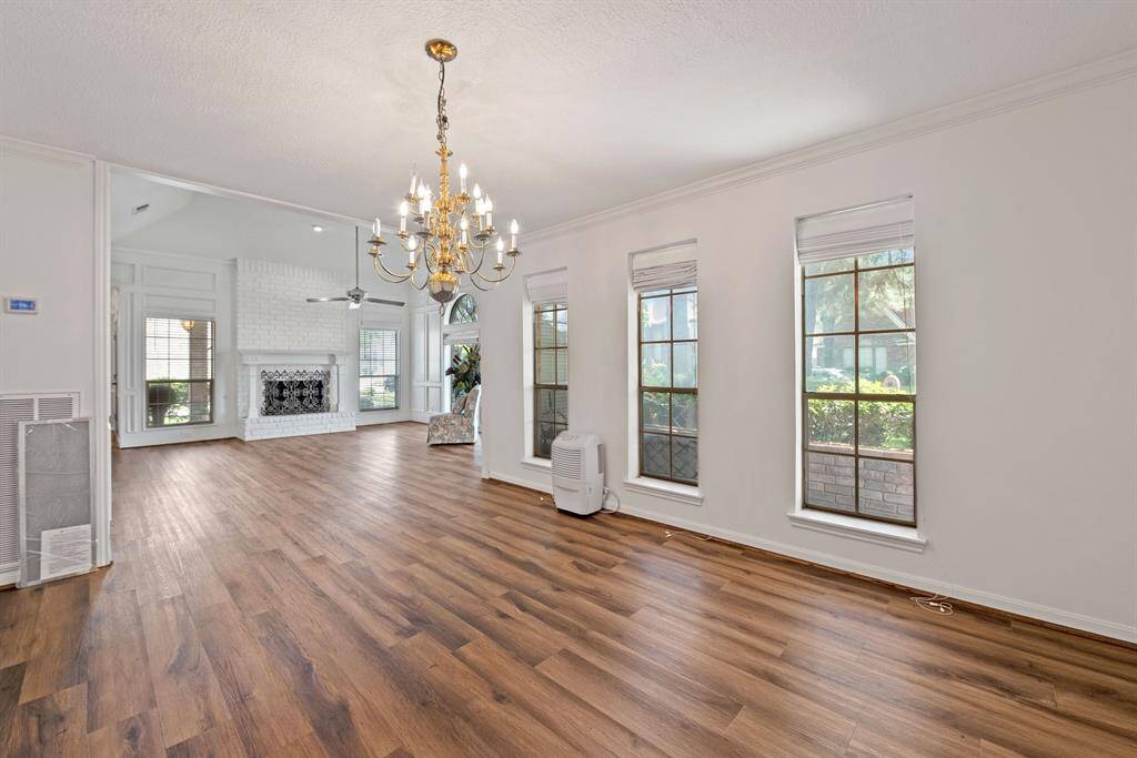 Living room opens directly into formal dining room.