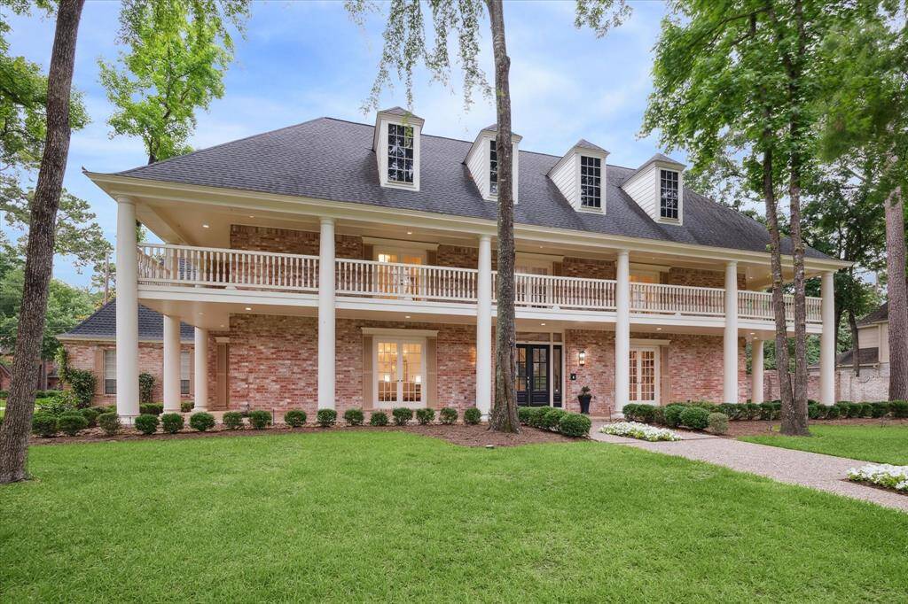 FRONT ELEVATION - Situated on a picturesque double corner lot on almost a half acre with sophisticated renovations, this property enjoys exceptional presence and curb appeal.