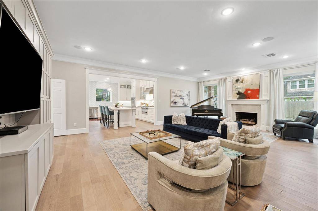 Another view of the oversized LIVING ROOM with several seating spaces.