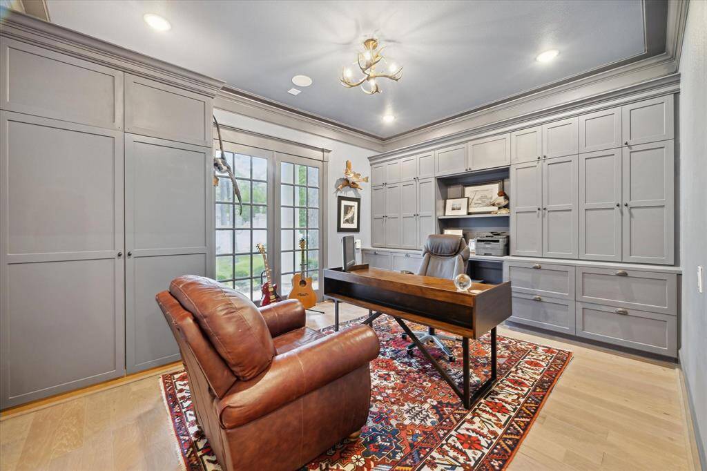 HOME OFFICE / STUDY - one of two, this study overlooks the back yard and offers an abundance of cabinet and drawer space.