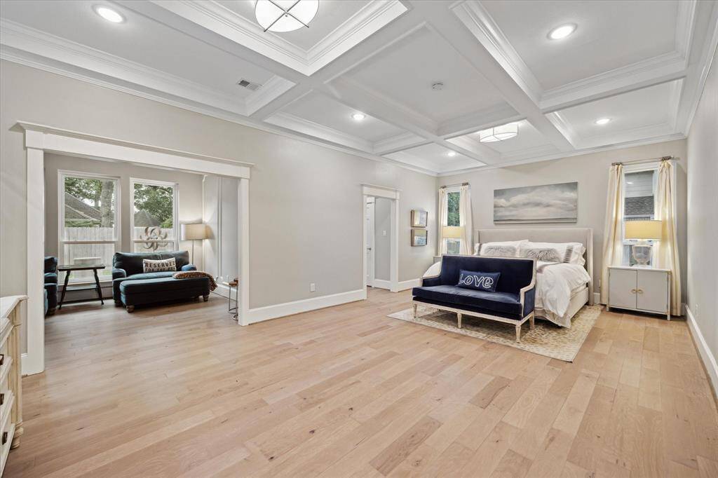 The PRIMARY BEDROOM with striking beamed ceiling, is privately situated at the back of the first floor overlooking the back yard. The attached spacious sitting room is a flexible space that could also be a nursery, work out room or even another home office if needed.