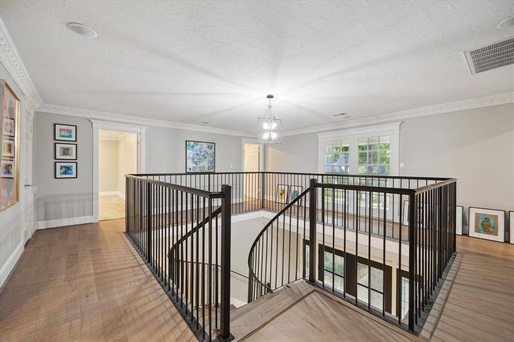 the graceful staircase leads you to the five secondary bedrooms on the second floor.
