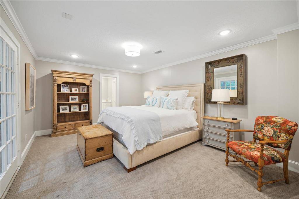 This spacious SECONDARY BEDROOM overlooks the front yard.