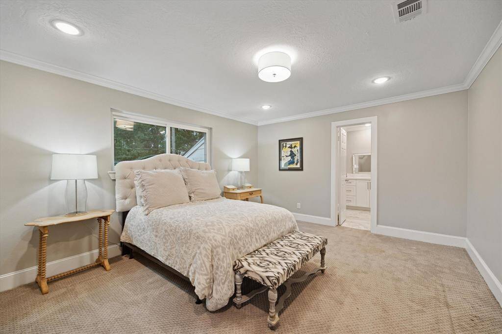 Another SECONDARY BEDROOM with enormous closet off the bathroom is situated at the back of the house.