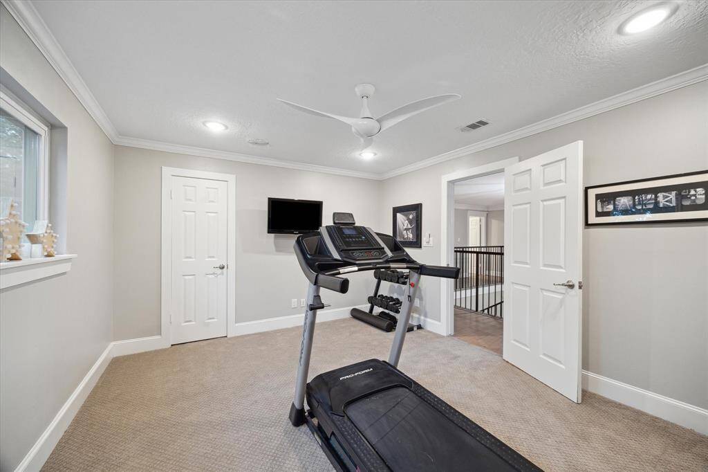 This SECONDARY BEDROOM is currently being used as a home gym and offers beautiful tree top views of the back yard.