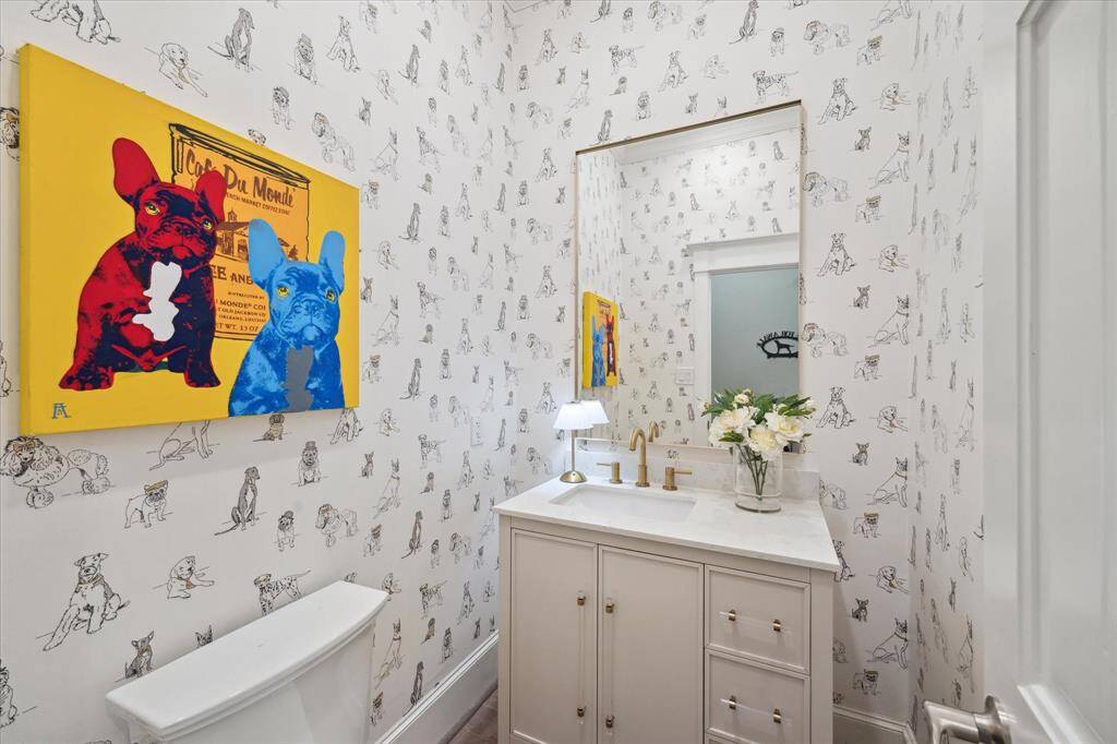 One of the two first floor POWDER BATHS off the garage and utility room will impress any dog lover!