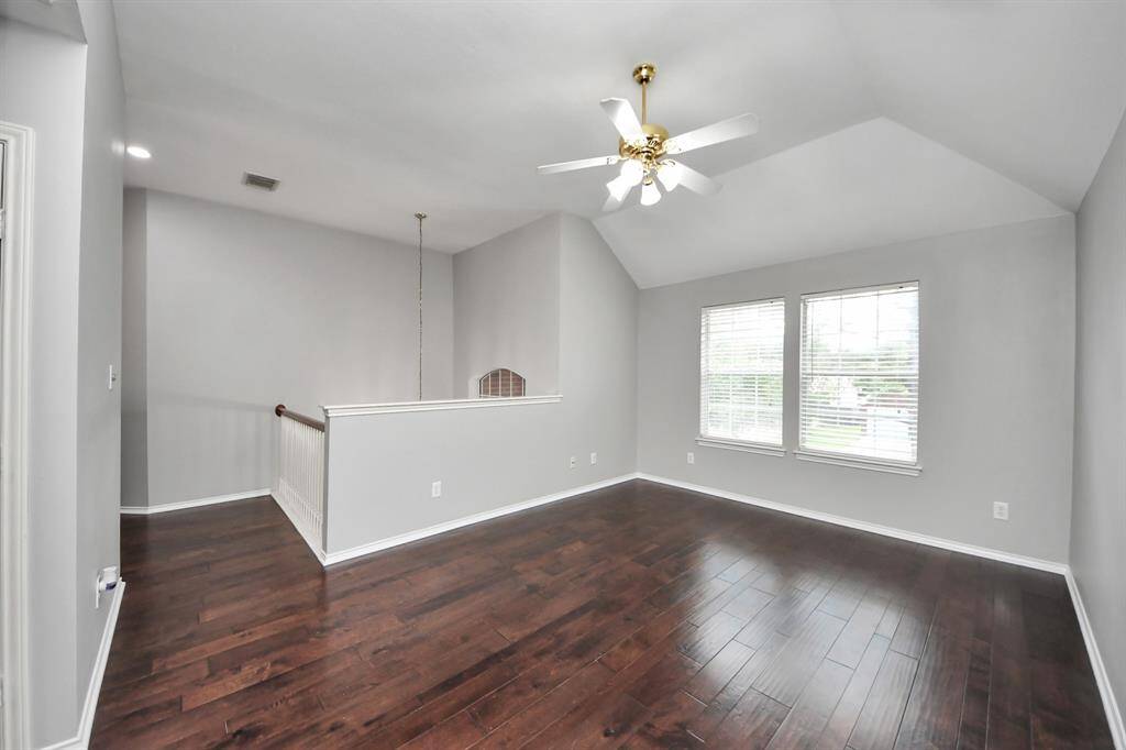 The spacious second-floor gameroom is designed for both relaxation and entertainment. It features gleaming wood floors, which add a touch of elegance and warmth to the room. Large windows allow an abundance of natural light to pour in, brightening the space and providing beautiful views of the surrounding area.