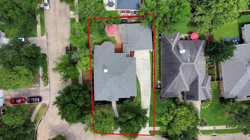 Enjoy this aerial view of this beautiful Perry home, perfectly situated on a corner lot. Estimated property lines are shown for reference; buyer to verify.
