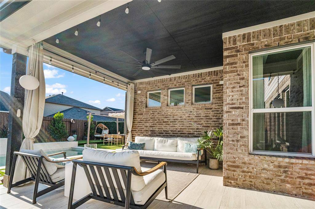 Extended patio with custom solar shades!