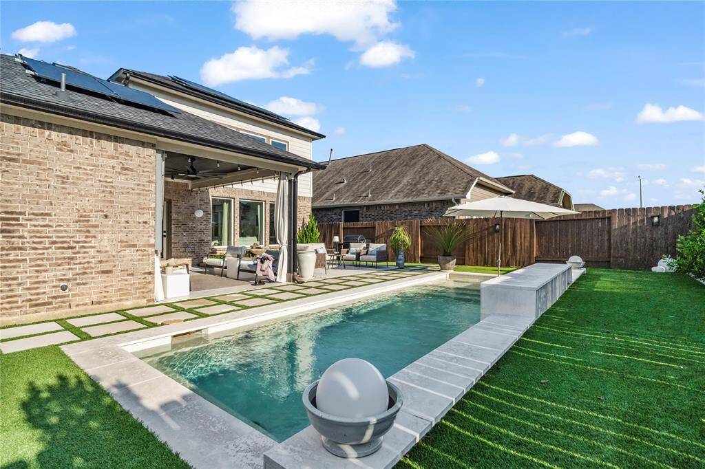 Custom pool with sea shell water fall
