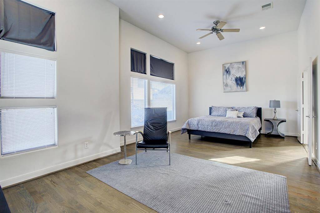 HUGE Primary Bedroom with sitting area. Abundant light on two two sides of room, 12 foot ceilings.