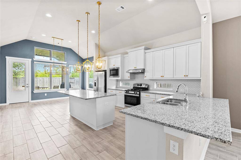 Spacious kitchen with a sleek breakfast bar, perfect for casual dining and entertaining.