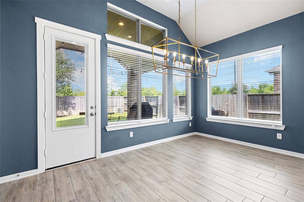 Bright dining room with stunning backyard views.