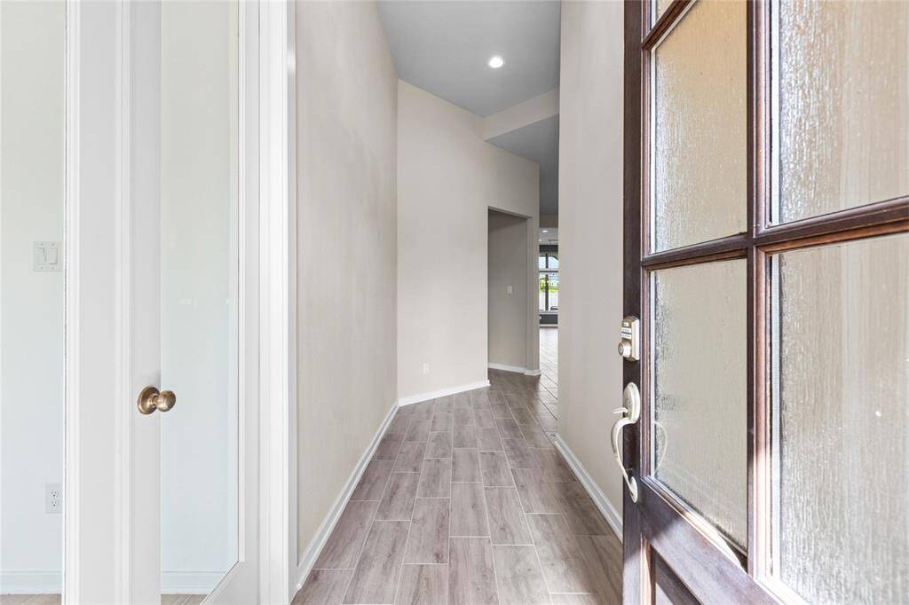 Welcome home to a bright and inviting entryway, featuring elegant flooring and modern finishes that set the tone for the rest of the house.