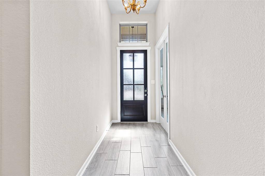 Entryway with an inviting study or office right at the entrance.