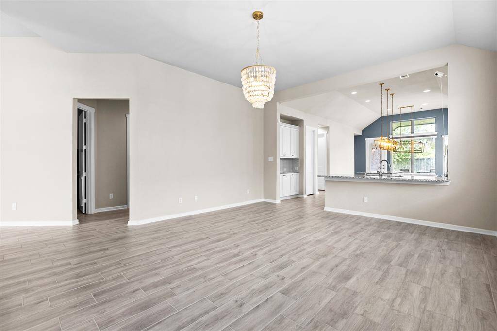 Enjoy seamless living with an open-concept living room and a kitchen featuring a stylish breakfast bar.