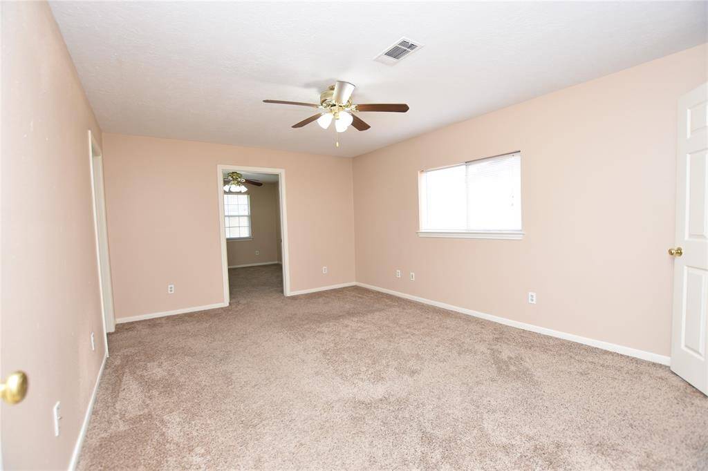 This primary bedroom offers a straightforward, functional layout designed for everyday comfort. Adjacent to the bedroom, a versatile bonus room extends the living space, providing endless possibilities.