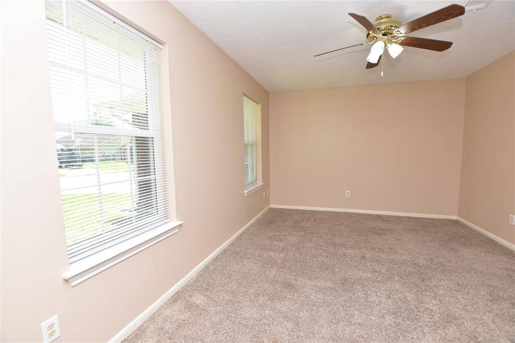 This home features two well-appointed secondary bedrooms, each offering ample space and natural light, making them ideal for family members, guests, or as versatile home office.
