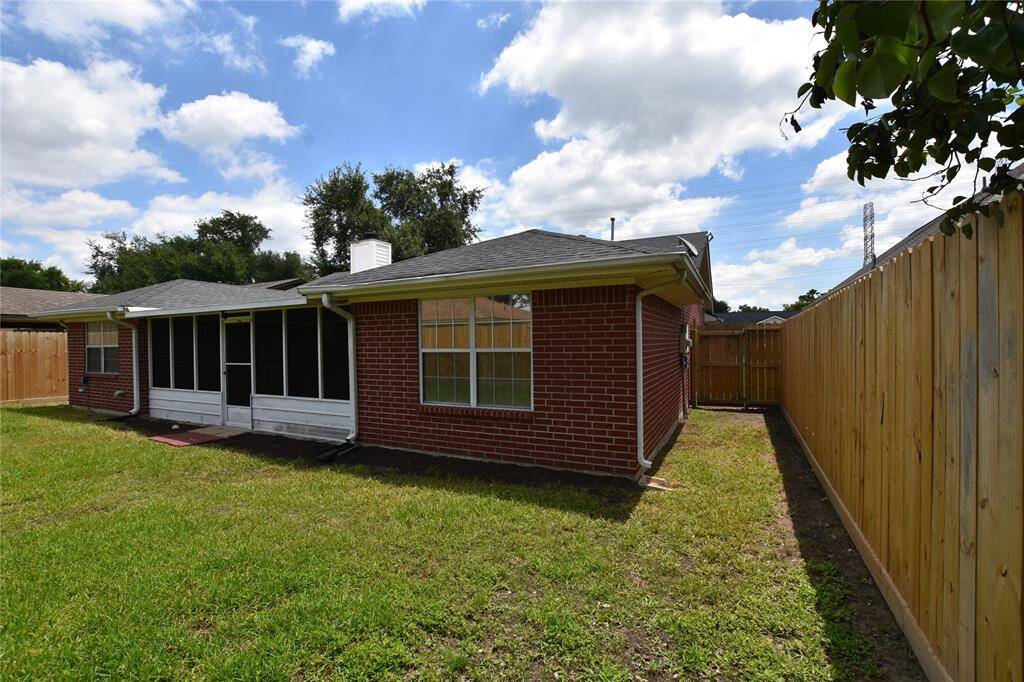 The perimeter is enclosed with a sturdy fence, ensuring privacy and security.