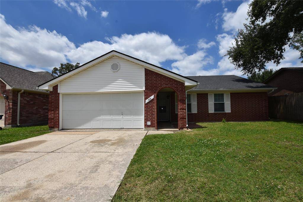 This red brick home with white shutters and trim offers a timeless appeal that transcends architectural trends.