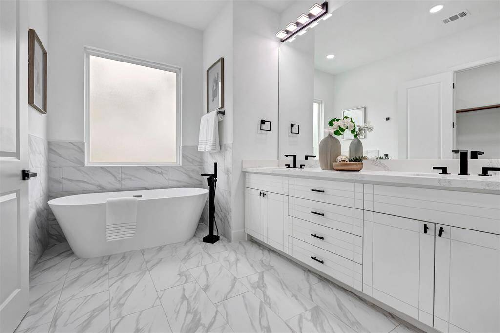 The luxurious freestanding tub is perfect for relaxation.