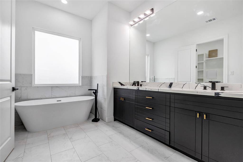 The luxurious freestanding tub is perfect for relaxation.