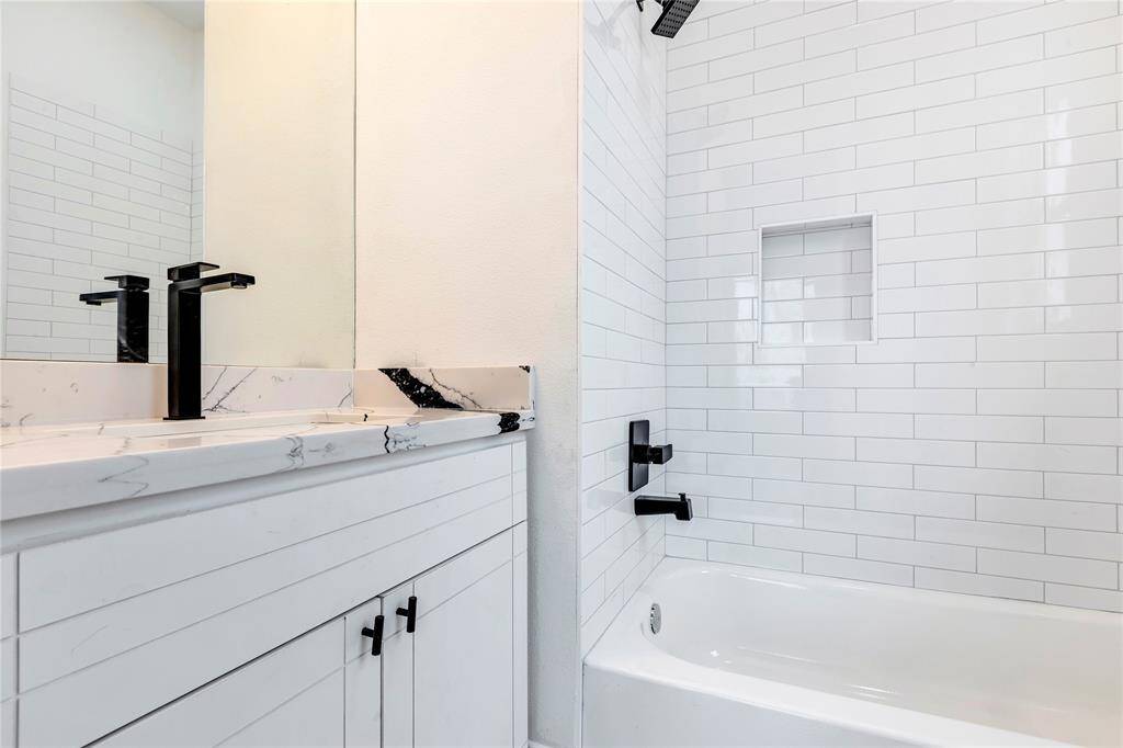 The guest bedroom on the third floor has an en-suite bathroom.