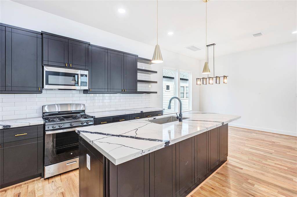 The kitchen provides ample storage space and counter space.