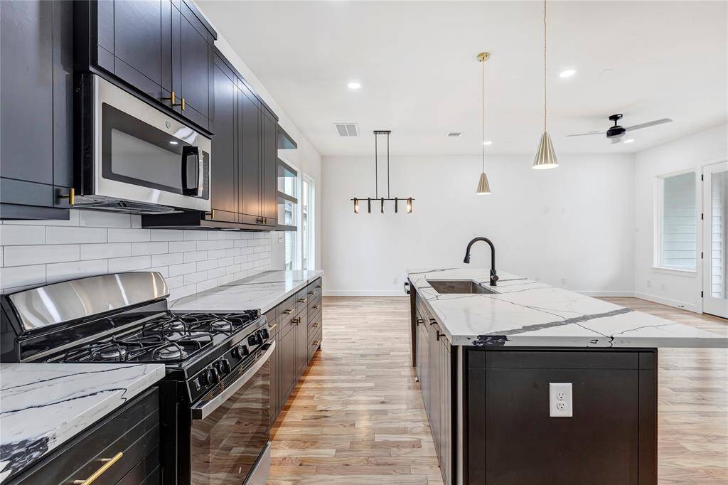 Elegant quartz countertops creating a bright, airy atmosphere in the kitchen.