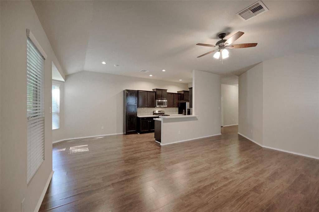 A view of the kitchen and dining area from the living room.