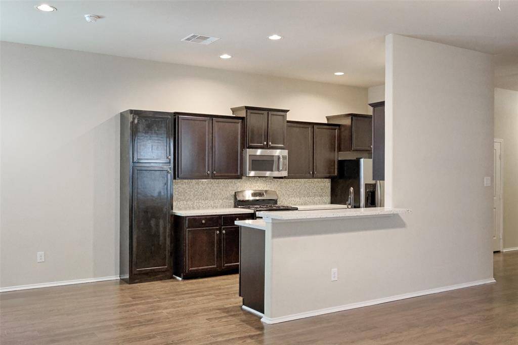 An extended countertop at this space provides additional seating options.