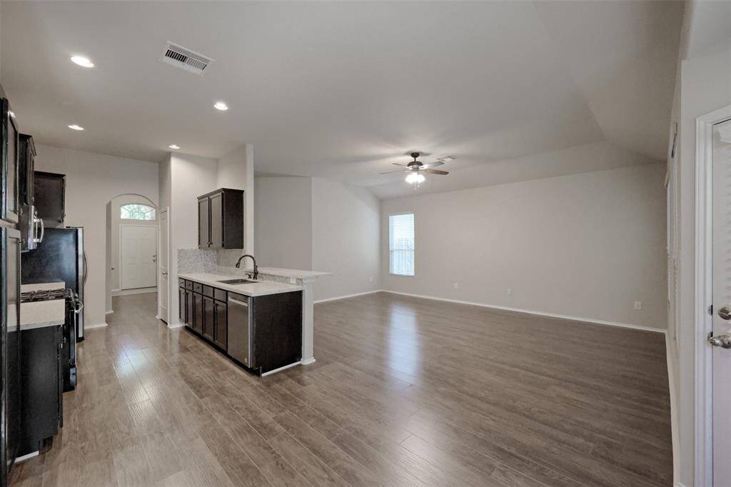 The open floor plan makes it easy to entertain or to converse with family while in the kitchen.