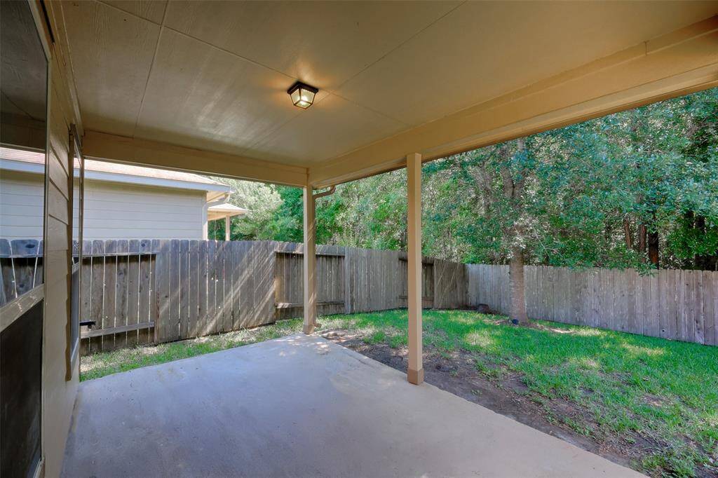 A large covered back porch is great for enjoying the outdoors.