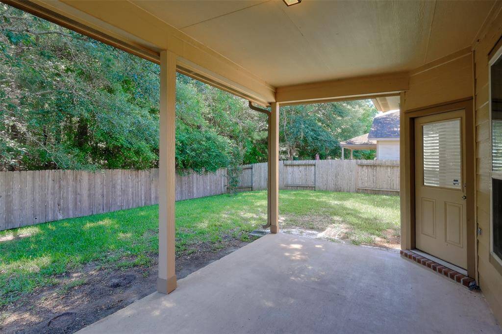 Doorway to the breakfast area and living room provide easy access to the back porch.