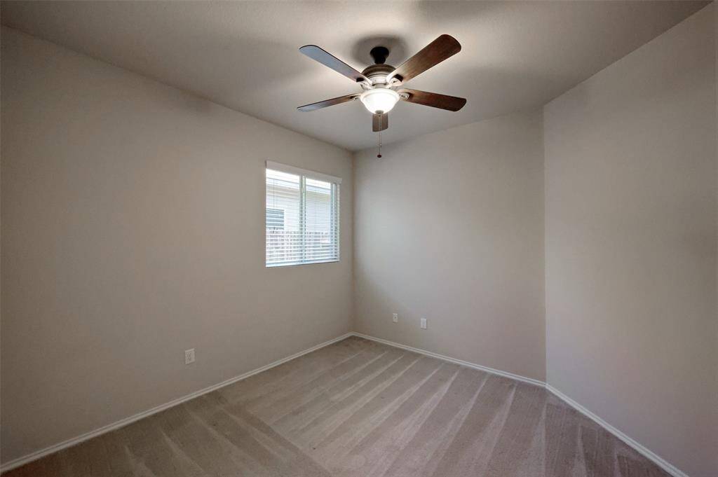 Guest bedroom with double door closet.
