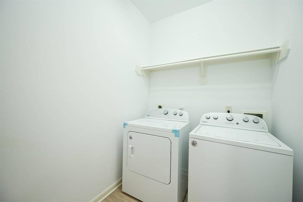 The laundry room features washer and dryer connections, andplenty of storage space.