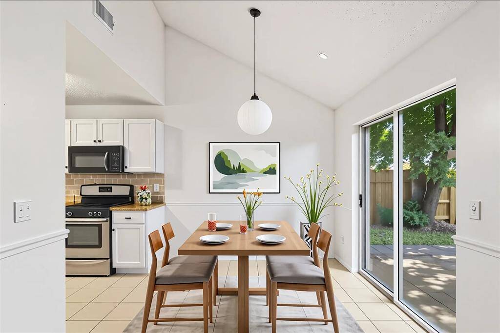 Breakfast room is virtually staged.